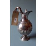 A Benetfink & Co of Cheapside silver plated ewer having half gadrooned decoration together with an