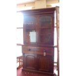 A 19th Century mahogany secretaire library bookcase having a pair of glazed panel doors above fully