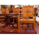 A set of six light oak ecclesiastical chairs with panelled backs and solid seats raised on