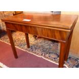 A Georgian mahogany and crossbanded tea table the foldover top raised on square section supports