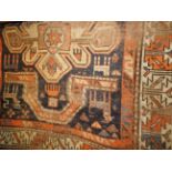 A Persian Shiraz rug, the twin pole medallion with corresponding ivory border.