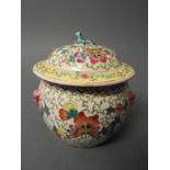 A Chinese style floral vase with lid and another similar
