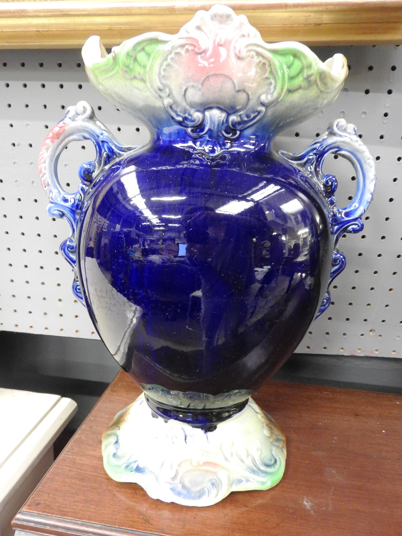 A pair of Majolica design twin handled blue porcelain vases