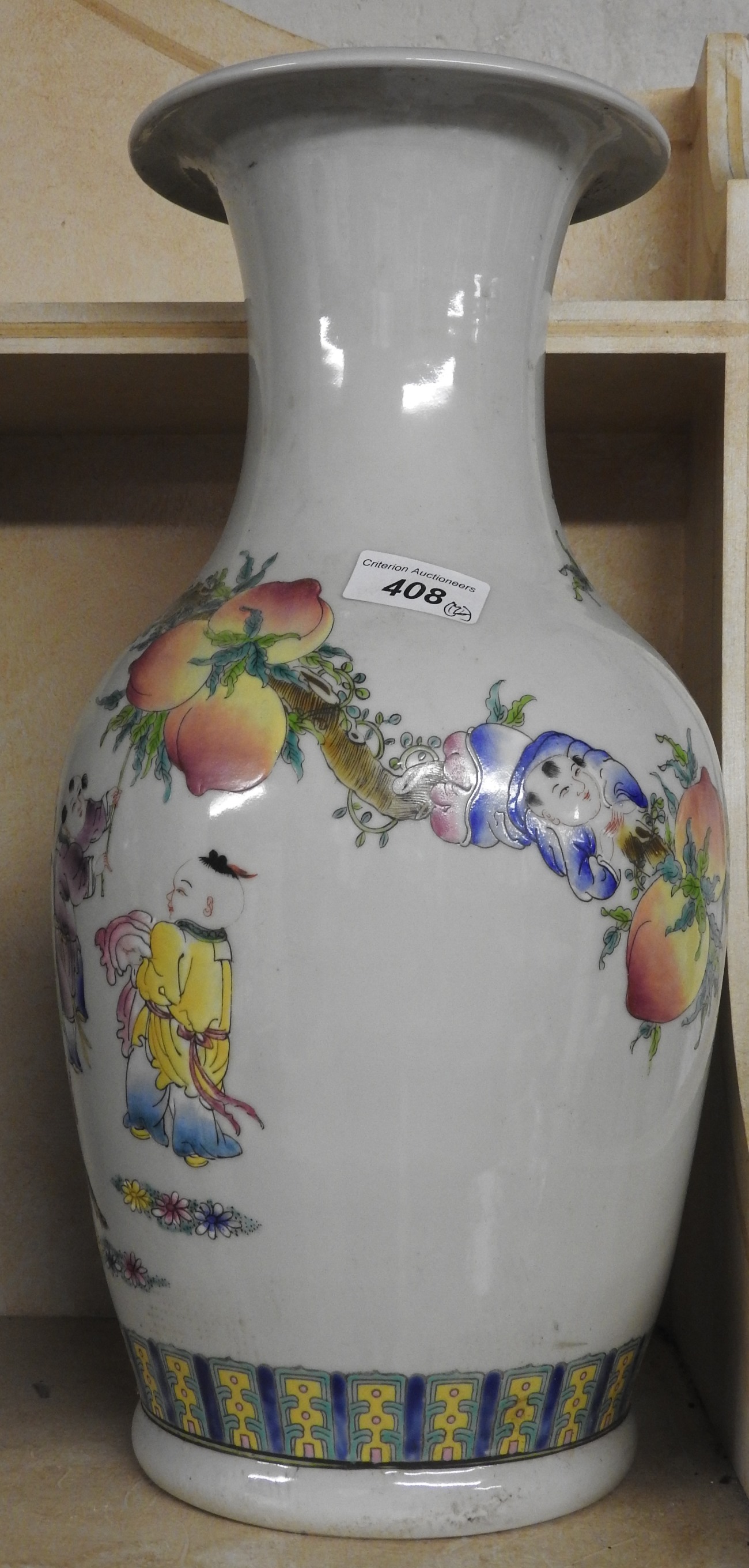 A pair of Chinese style vases with figural and floral decoration