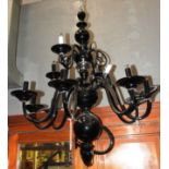 A contemporary designer twelve branch black glass chandelier by Flammant