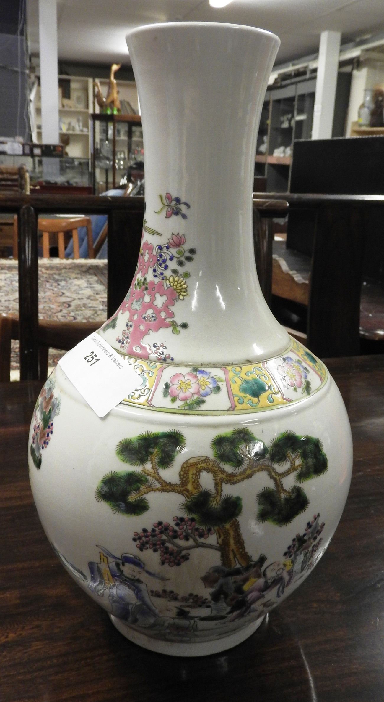 A Chinese style bulbous form vase with pictorial detail.