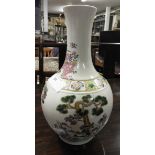 A Chinese style bulbous form vase with pictorial detail.