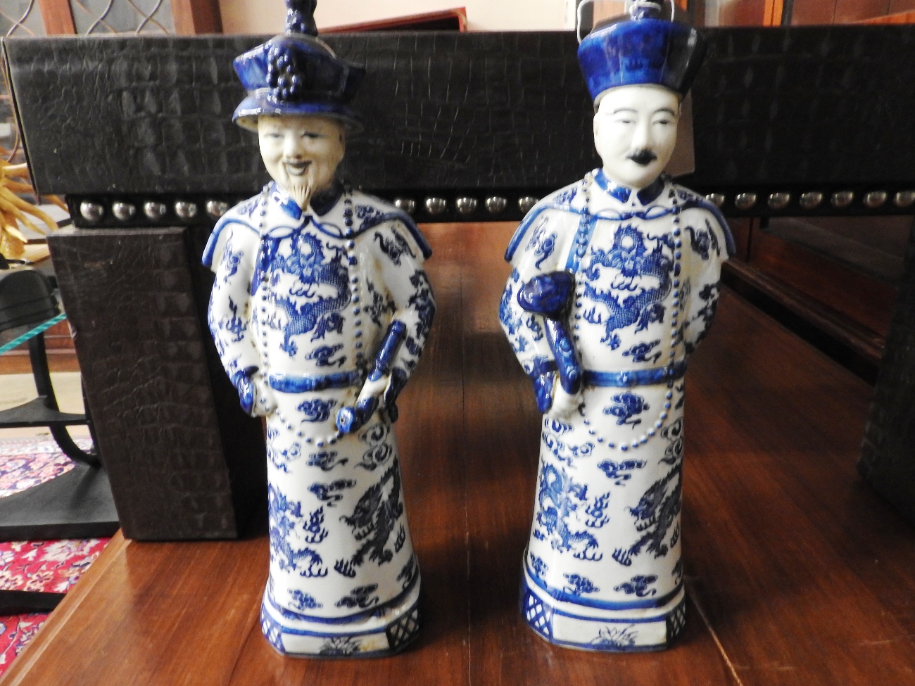 A pair of porcelain Chinese style gentlemans figures