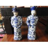 A pair of porcelain Chinese style gentlemans figures