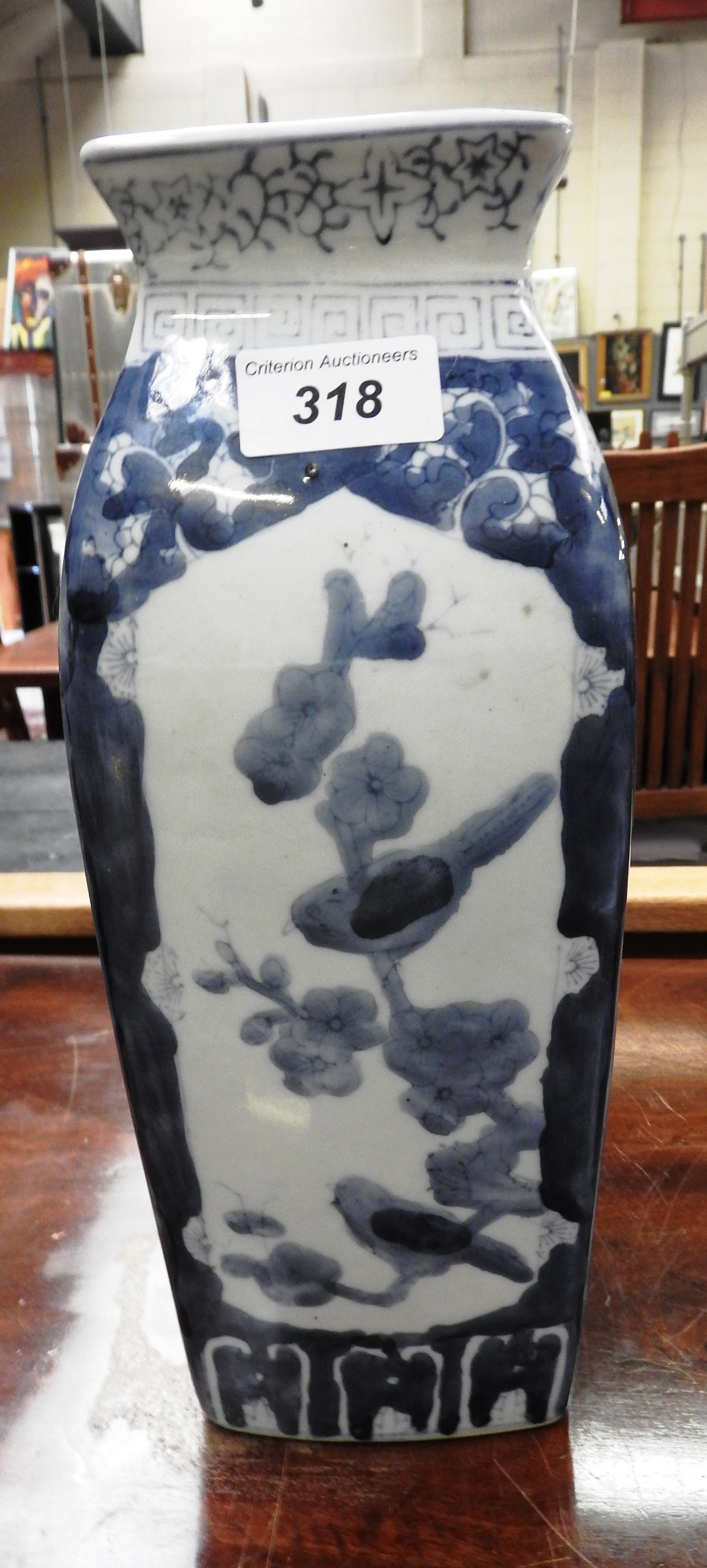 A porcelain Chinese style vase with floral and bird decoration