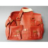 WITHDRAWN A red leather designer handbag, reputedly by Mulberry, having various buckles and pockets.