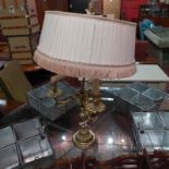 An Early 20th Century ormolu three branch table lamp with silk shade.