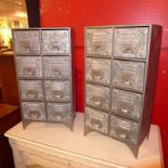 A pair of industrial style steel table top chests fitted eight drawers with cup handles
