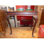 A Georgian mahogany silver table, the rectangular top raised on cabriole pad foot supports.