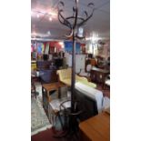 A bentwood hat and coatstand with revolving top.