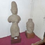 A stone statuette from Cambodia of a deity together with a similar bust (one a/f)