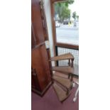 A Victorian style mahogany spiral set of library steps with leather inserts on castors