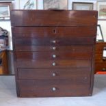 An antique mahogany portable surgeons cabinet with rising lid and six lined drawers.