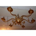 A 20th Century gold painted six branch chandelier with leafy detail.