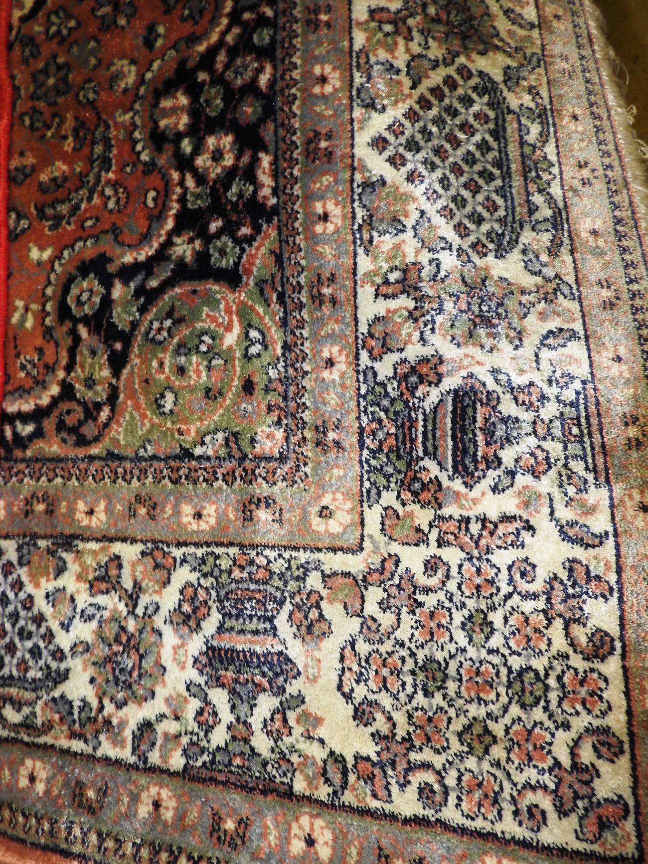 A Persian wool and silk Qum rug, the cen