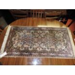 A small hard knotted Qum design silk rug
