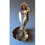 An Art Nouveau style spelter figure of l