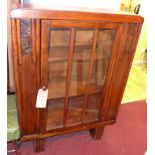 An Art Deco oak bookcase fitted central