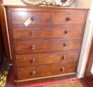 A Victorian mahogany chest fitted two short and four long drawers with moulded knob handles on