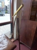 A brass telescope raised on adjustable w