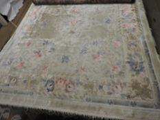 A Chinese silk rug, on a silk pile and s