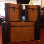 A set of three rattan and leather clad s