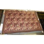 A Barbarbian kilim, the all over floral design on maroon ground within repeated geometric borders,