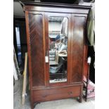 An Edwardian mahogany wardrobe,