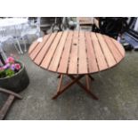 A teak garden folding table