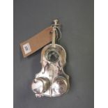 A silver plated cruet set in the form of a violin
