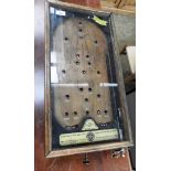 A functioning table top vintage pin ball table