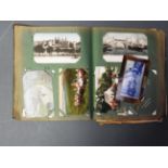 An early 20th Century postcard album,