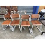 A collection of eight stacking chairs