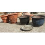 A pair of large terracotta pots and two others.