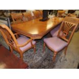 A Continental style bleached wood dining table,