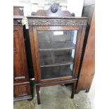 An early 20th Century oak display cabinet,