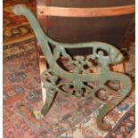 A pair of green painted cast iron bench supports