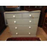 A 19th Century Victorian grey painted chest of two short over three long graduated drawers raised