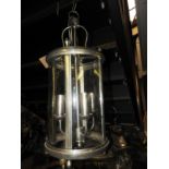 A chrome four branch glass hanging ceiling lantern