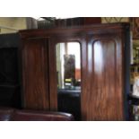 A 19th Century Victorian mahogany triple wardrobe,