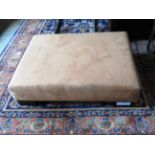 A contemporary designer low footstool,