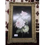 A pair of floral studies on black lacquer panels in ornate giltwood frames (2)