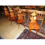 A set of four Bavarian oak hall chairs with solid seat on