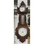 A late 19th Century clock barometer with anchor and floral motifs H.