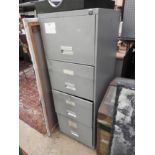 A large four drawer metal filing cabinet